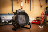 REX NORDIC HEAT 2000 fan heater in use on a workshop bench