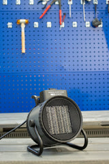 REX NORDIC HEAT 3000 fan heater in a workshop with tool wall