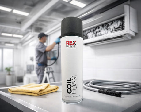 Technician cleaning an air conditioner, REX CoilFoam in the foreground