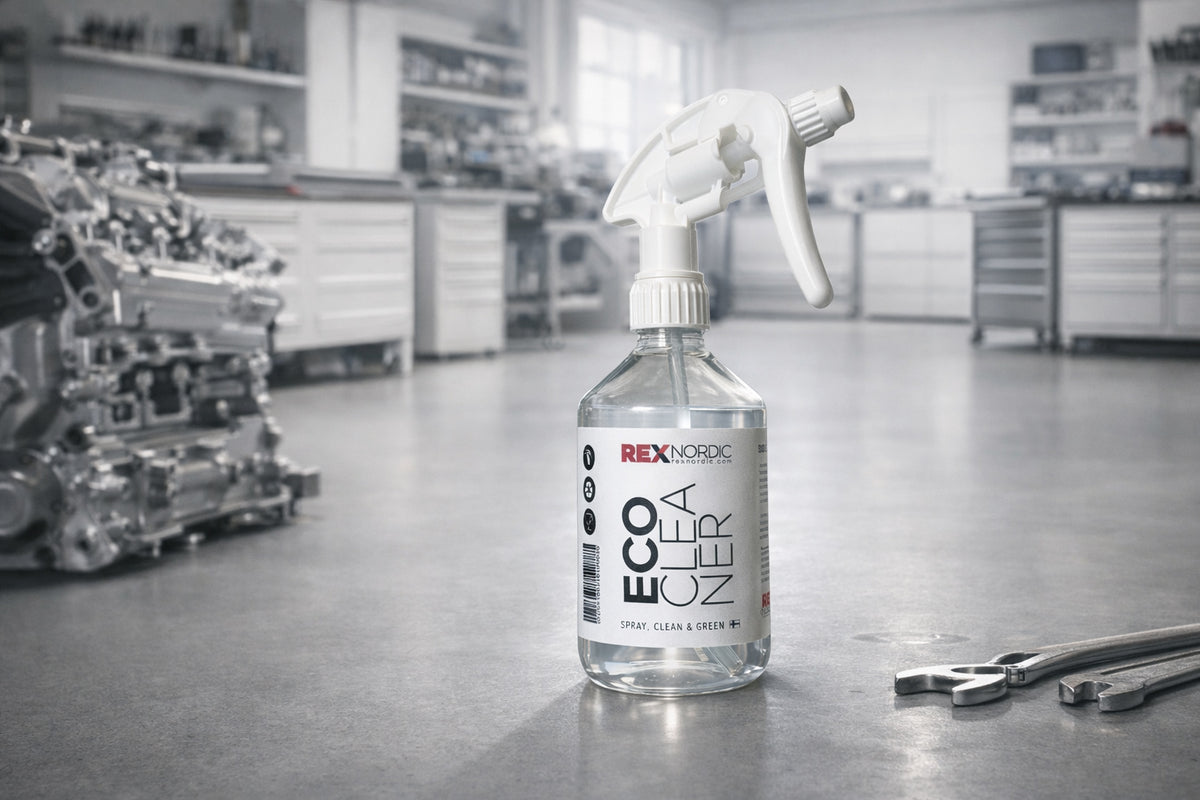 REX EcoCleaner spray bottle in a workshop next to an engine