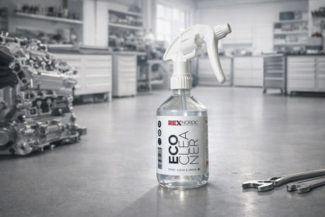 REX EcoCleaner spray bottle in a workshop next to an engine