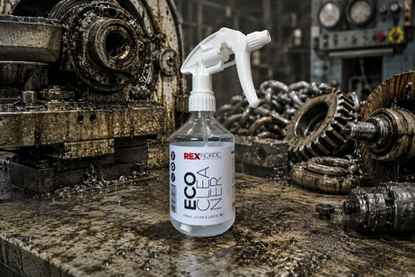 REX EcoCleaner spray bottle among greasy gears and chains