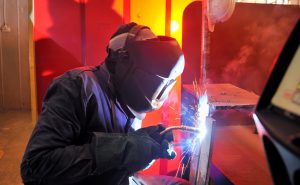Man is welding metal